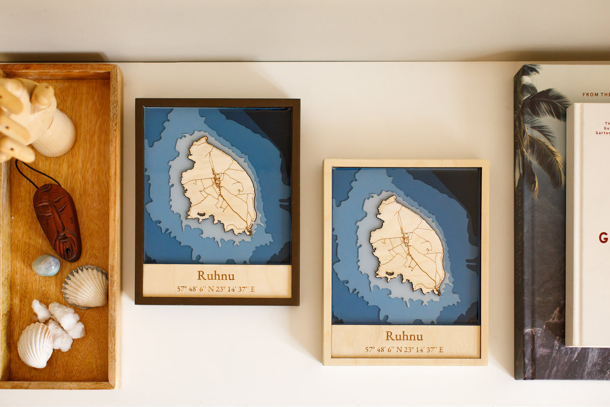 Two custom laser cut maps of Ruhnu, Estonia.